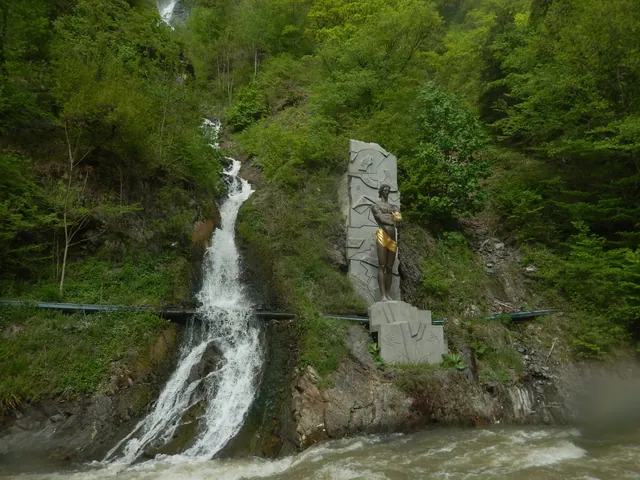 Waterfall and the statue of Prometheus in Borjomi Central Park