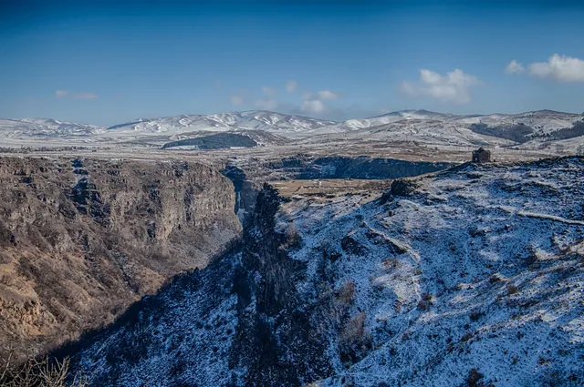Winter view of Dashbashi Canyon and a church on the edge of the gorge