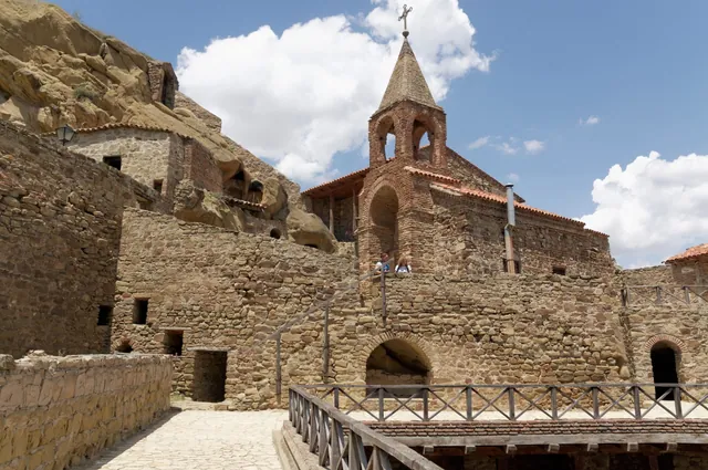 The Lavra courtyard and bell tower against the cliff face with its cells